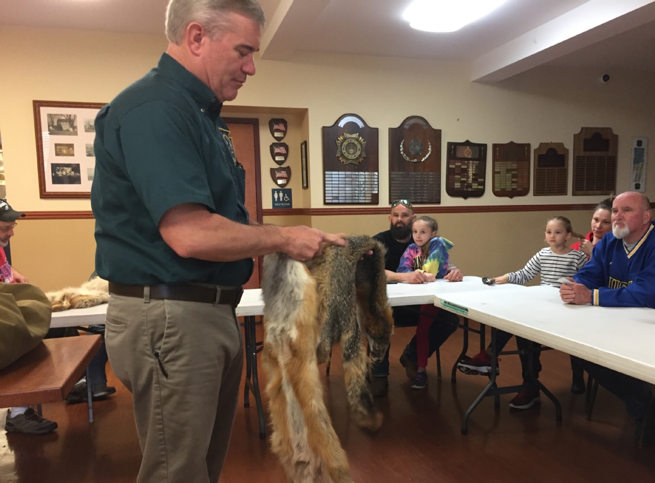 PA Game Commission officer Dan Lynch shows various animal pelts to attendees of Wildlife for Everyone program at Post 845 on 4/28/19.